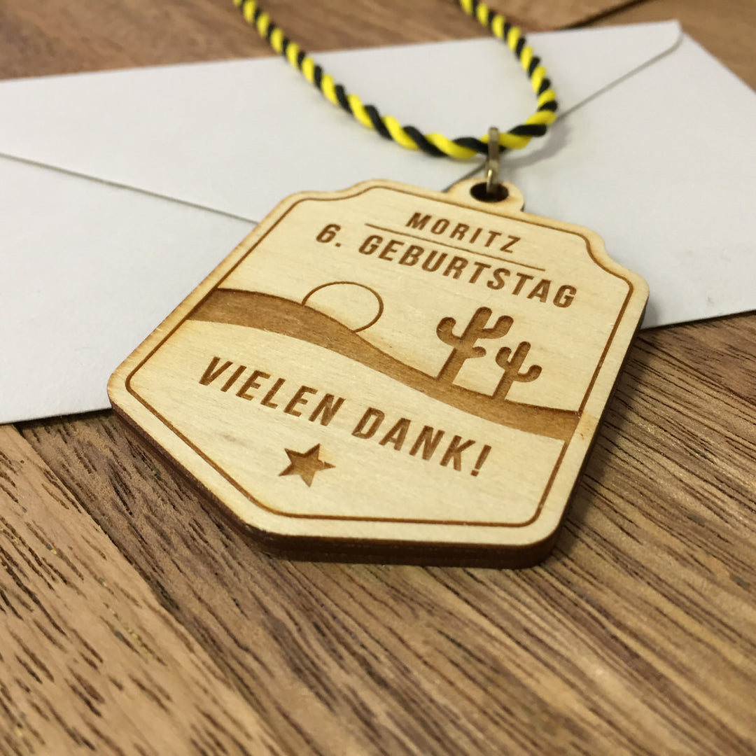 6+ Holzmedaillen "Wilder Westen" als Gastgeschenk