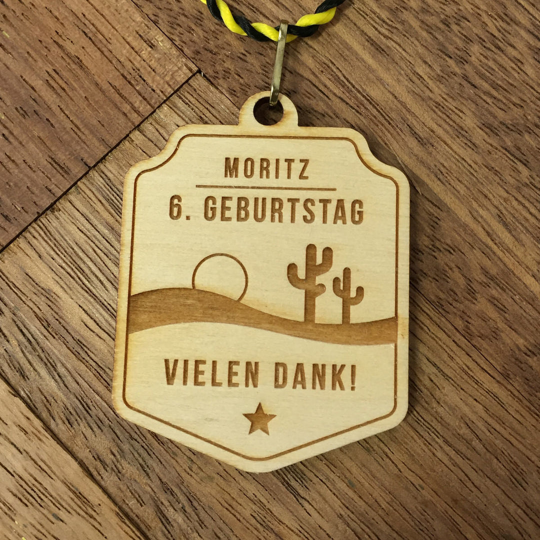 6+ Holzmedaillen "Wilder Westen" als Gastgeschenk