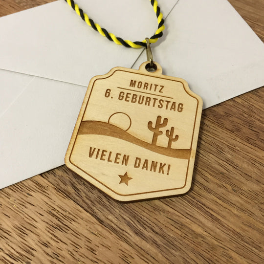 6+ Holzmedaillen "Wilder Westen" als Gastgeschenk